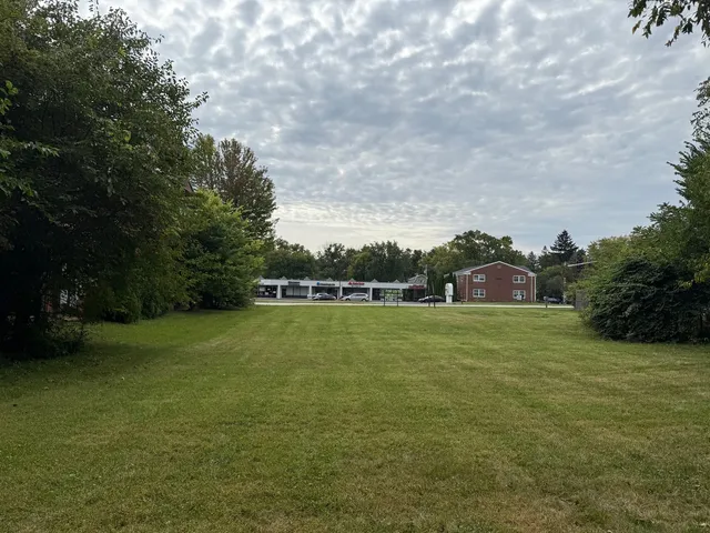 a view of a green field with clear sky