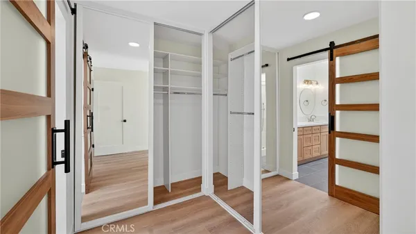 a bathroom view of a toilet and a shower