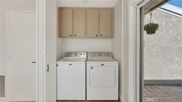 a view of a house with a yard and plant