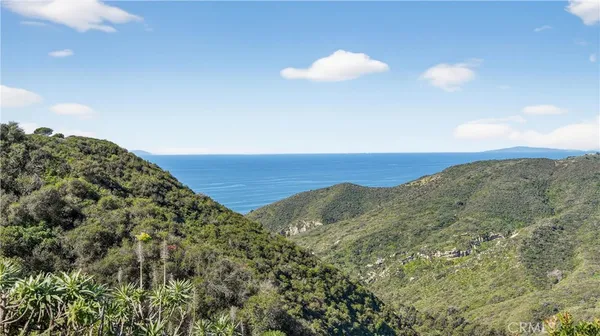 a view of mountain with sunset