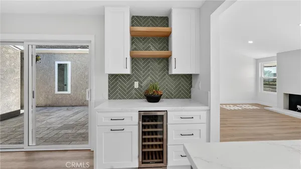 a kitchen with a sink and large window