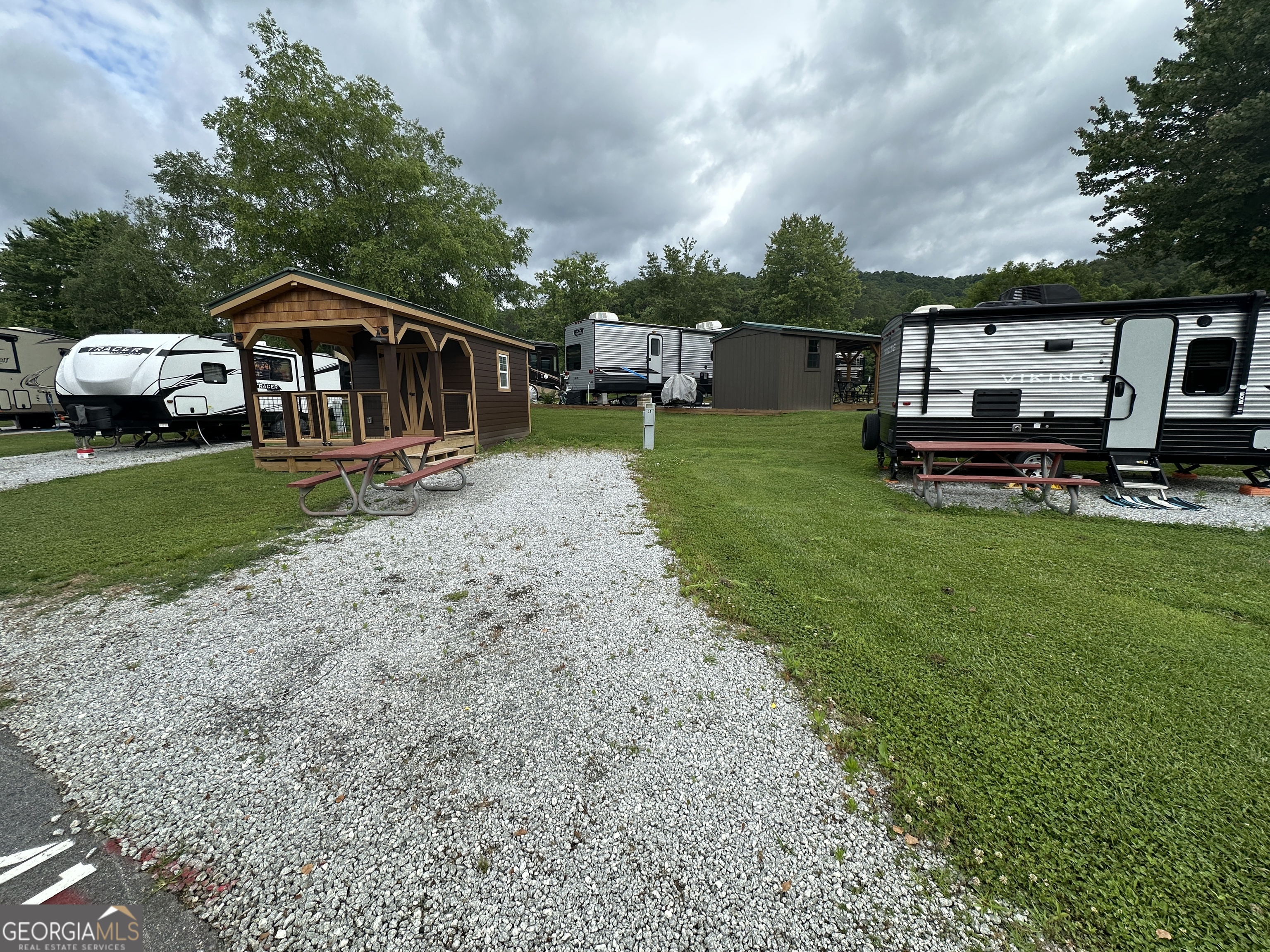 41 Monaco Lane Dillard, GA 30537 - Photo 3 of 16 a car parked in front of a house with a yard