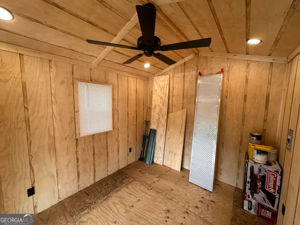 a view of a balcony with wooden floor