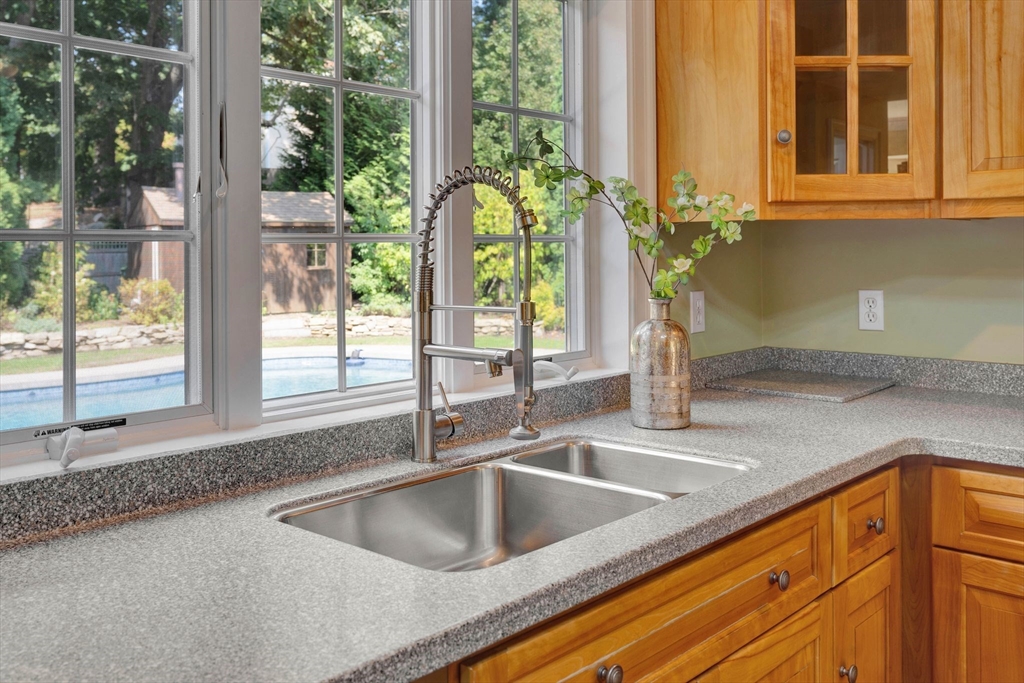 5 Chapel Hill Road Beverly, MA 01915 - Photo 15 of 41 a kitchen sink with a granite countertop window and sink