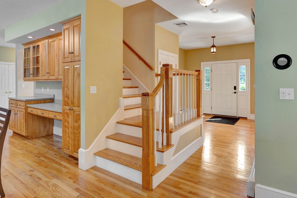 5 Chapel Hill Road Beverly, MA 01915 - Photo 18 of 41 a view of a hallway view with wooden floor and staircase