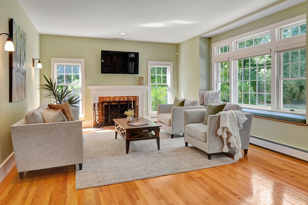 5 Chapel Hill Road Beverly, MA 01915 - Photo 19 of 41 a living room with furniture a fireplace and a flat screen tv