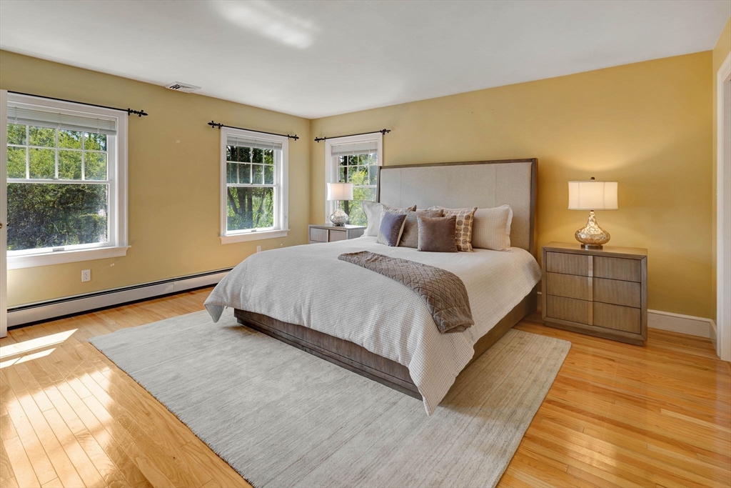 5 Chapel Hill Road Beverly, MA 01915 - Photo 22 of 41 a bedroom with a bed lamp and a large window