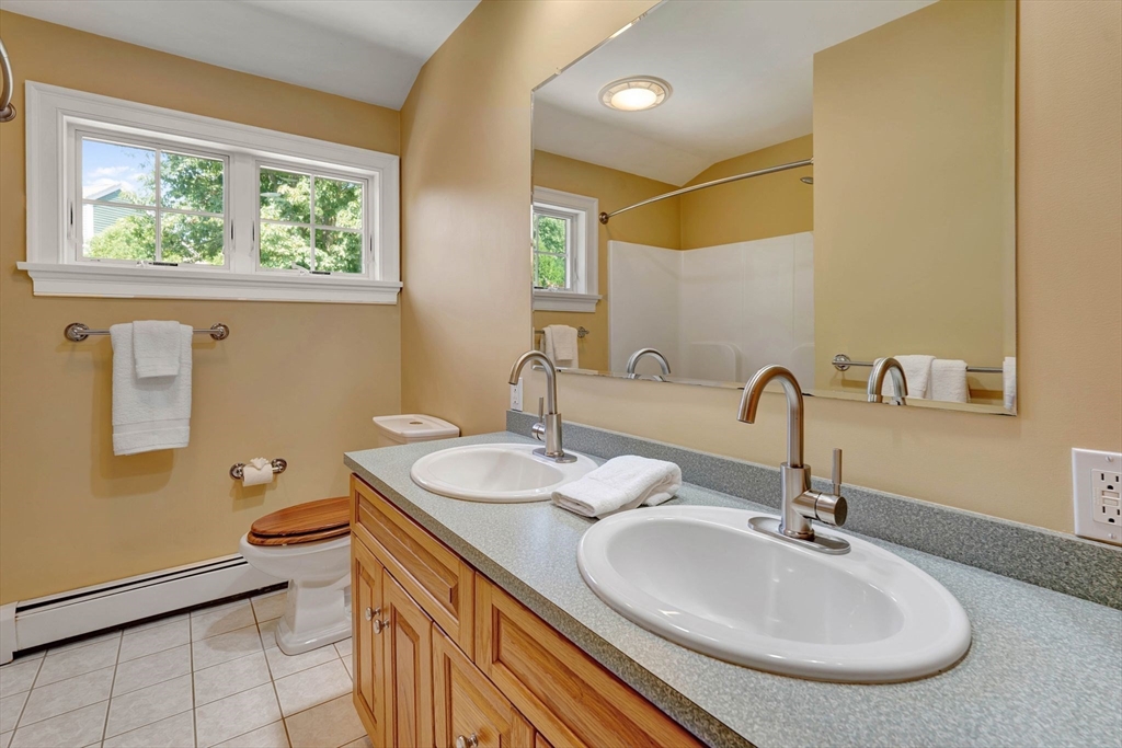 5 Chapel Hill Road Beverly, MA 01915 - Photo 23 of 41 a bathroom with 2 sink and a mirror