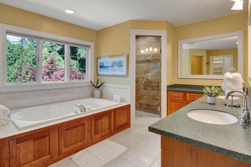 5 Chapel Hill Road Beverly, MA 01915 - Photo 24 of 41 a bathroom with a tub sink and mirror