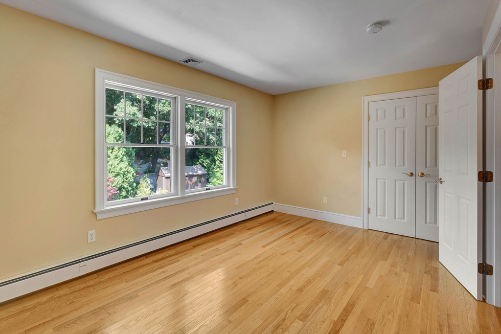 5 Chapel Hill Road Beverly, MA 01915 - Photo 30 of 41 a view of an empty room with wooden floor and a window