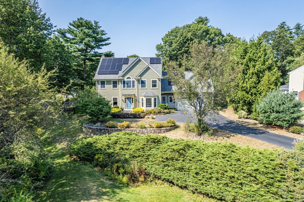 5 Chapel Hill Road Beverly, MA 01915 - Photo 3 of 41 a view of a house with a big yard and large tree