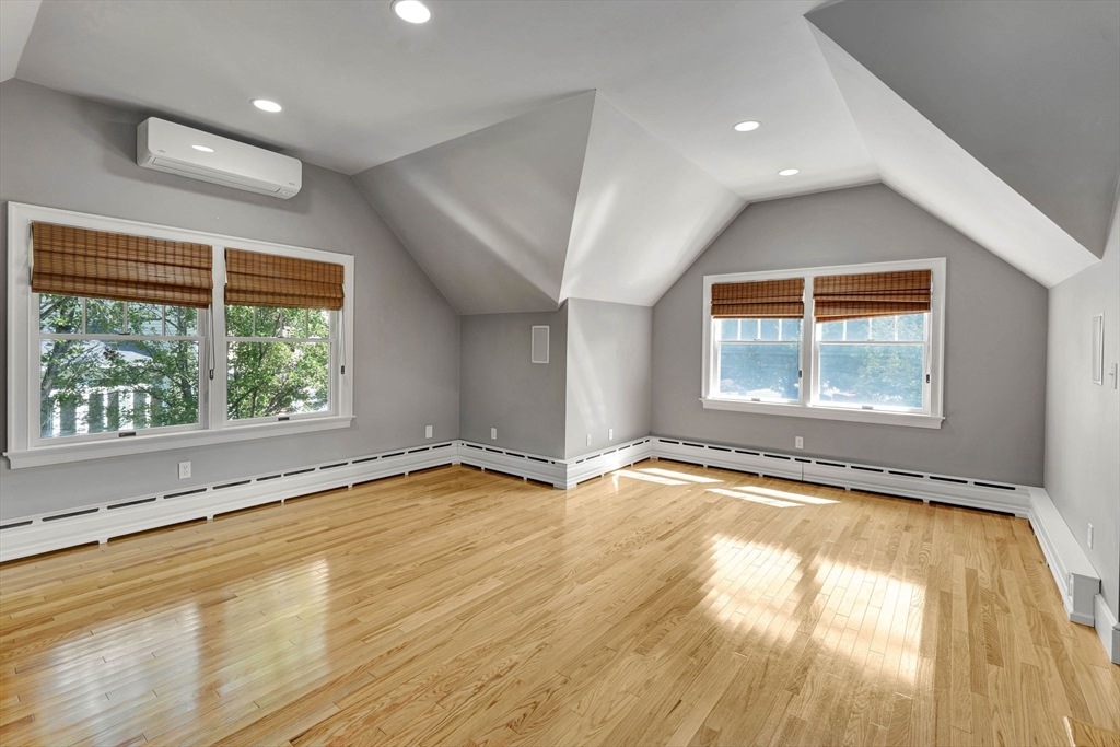 5 Chapel Hill Road Beverly, MA 01915 - Photo 36 of 41 en empty room with a window and wooden floor