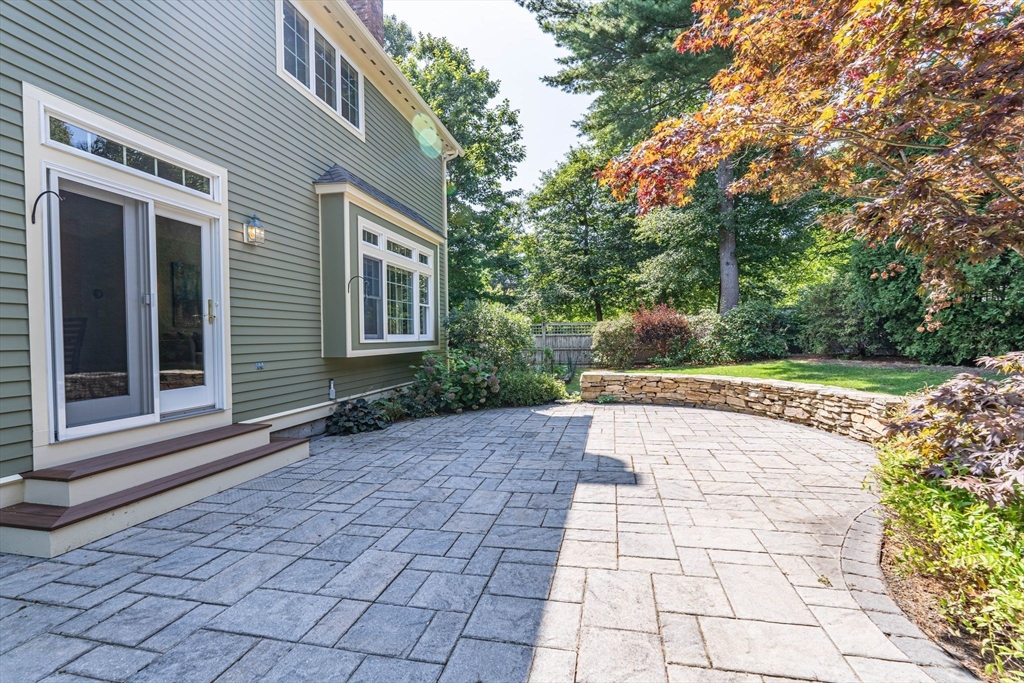 5 Chapel Hill Road Beverly, MA 01915 - Photo 7 of 41 a view of a yard with plants and large trees