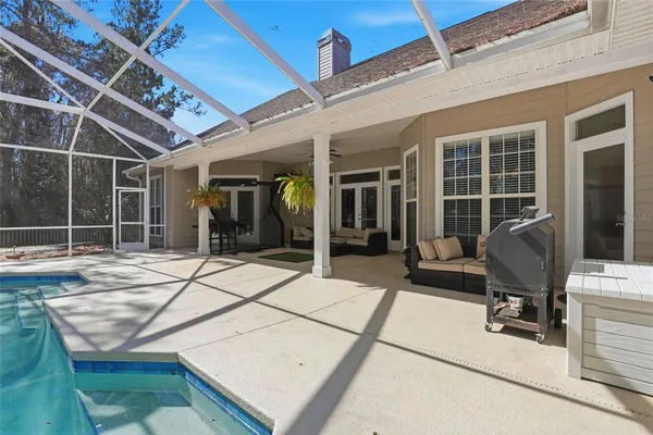 a building outdoor space with patio furniture and potted plants
