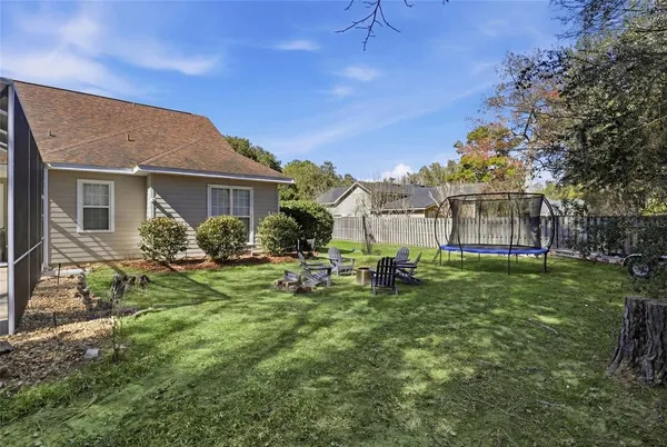 a view of a house with a yard porch and sitting area