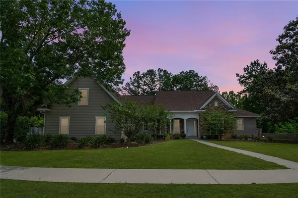 a front view of a house with garden