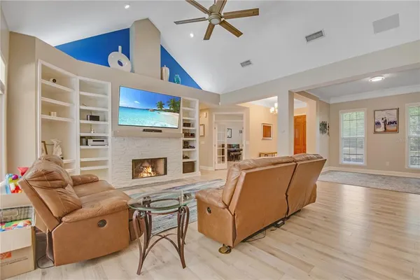 a living room with furniture and fireplace