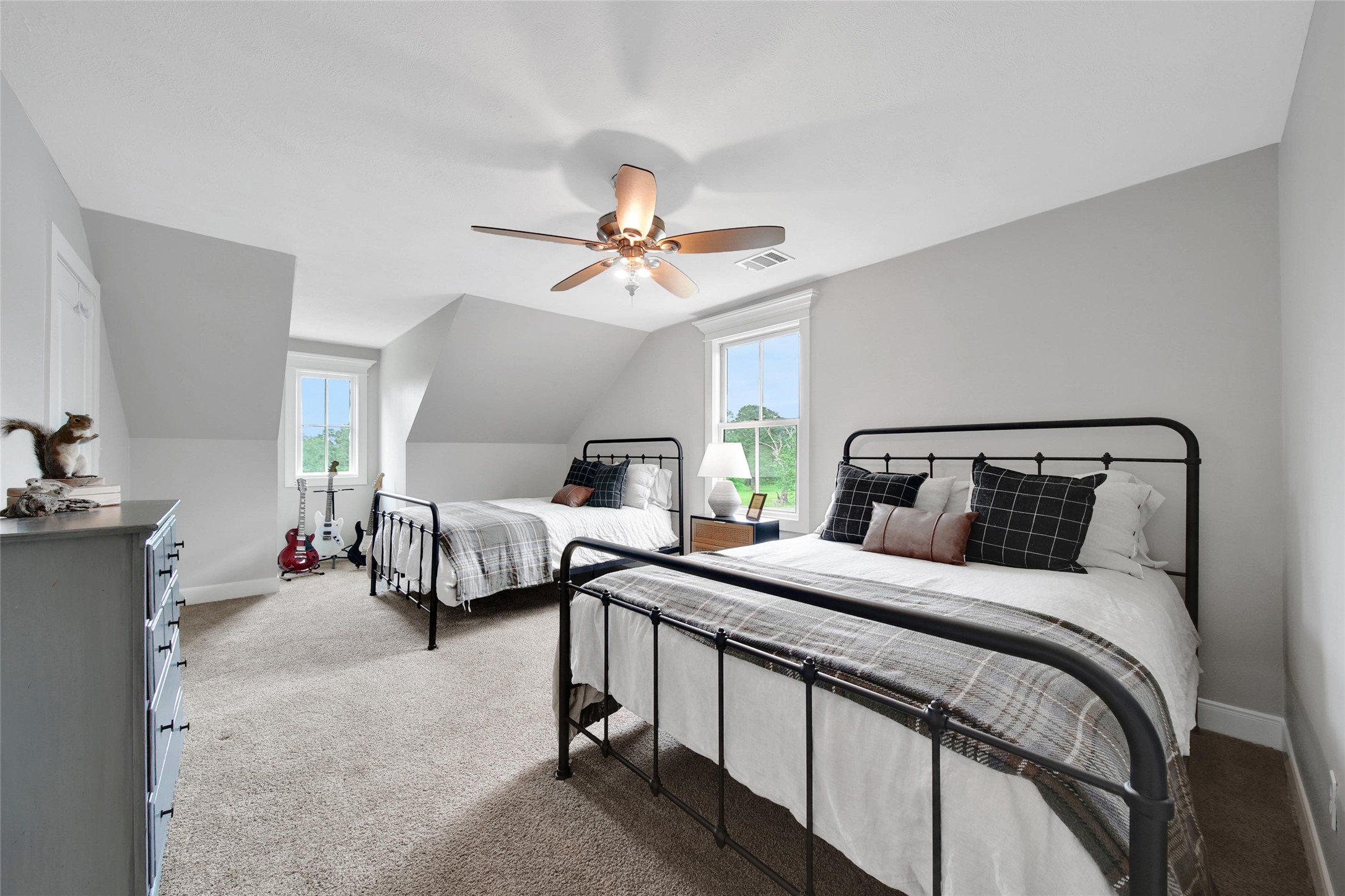 18875 Rabon Chapel Road Montgomery, TX 77316 - Photo 29 of 45 a bedroom with bed and a chandelier