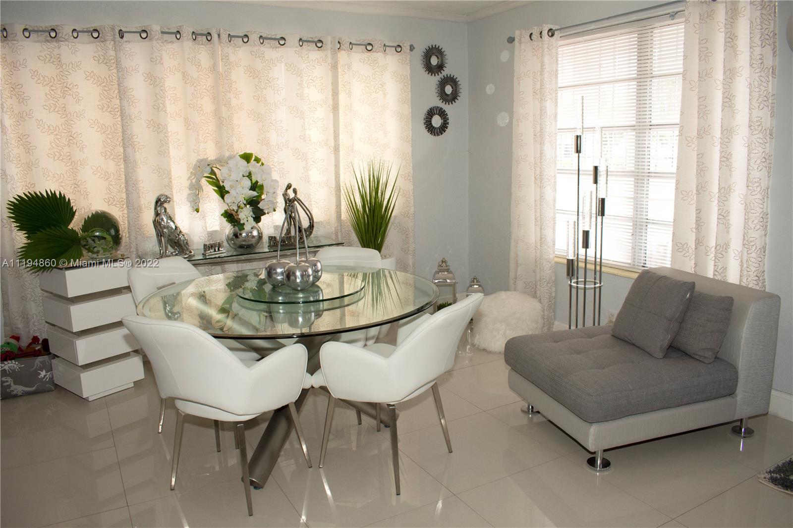 398 East 56th Street Hialeah, FL 33013 - Photo 14 of 30 a living room with furniture and a potted plant