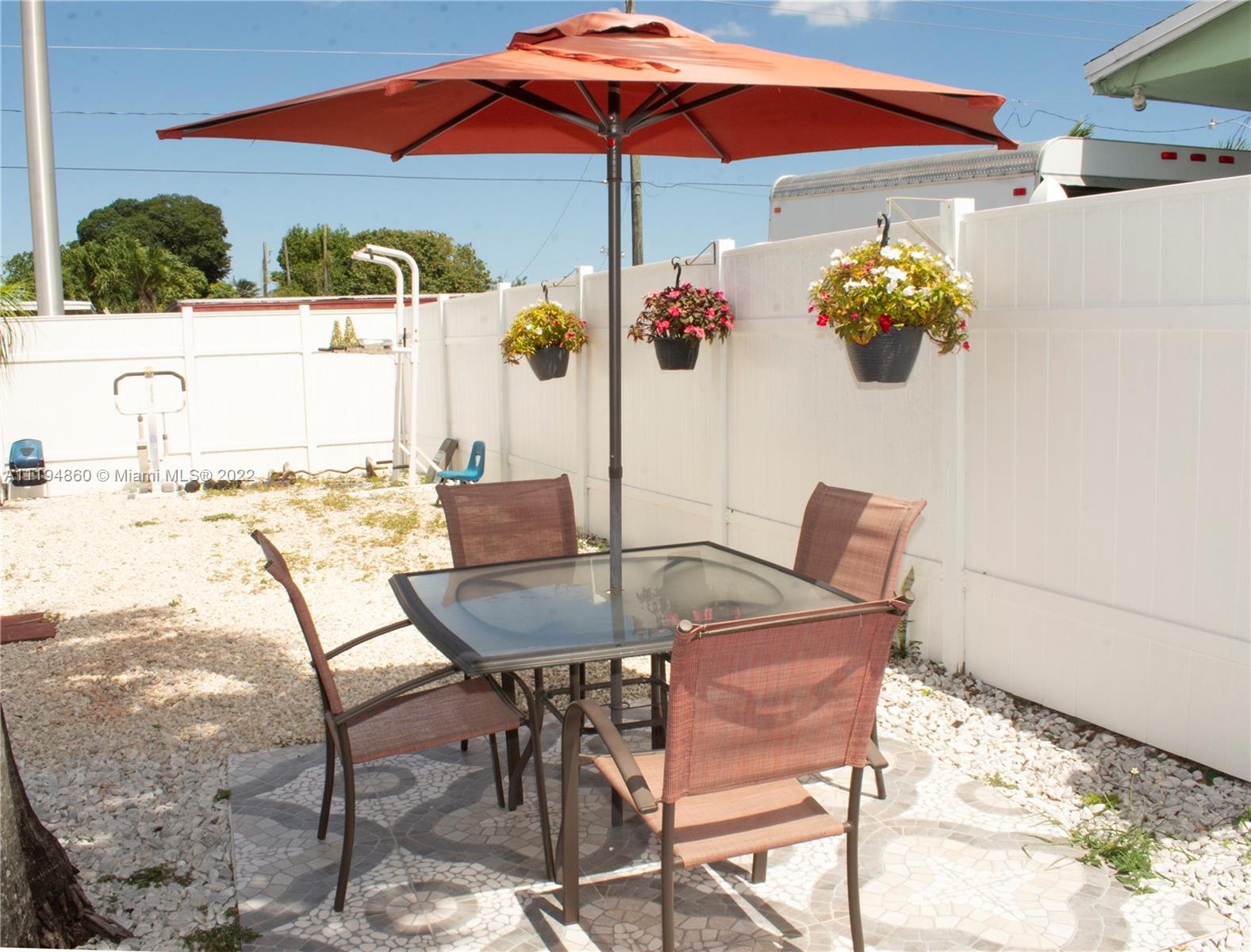 398 East 56th Street Hialeah, FL 33013 - Photo 15 of 30 a view of a chairs and table in the patio