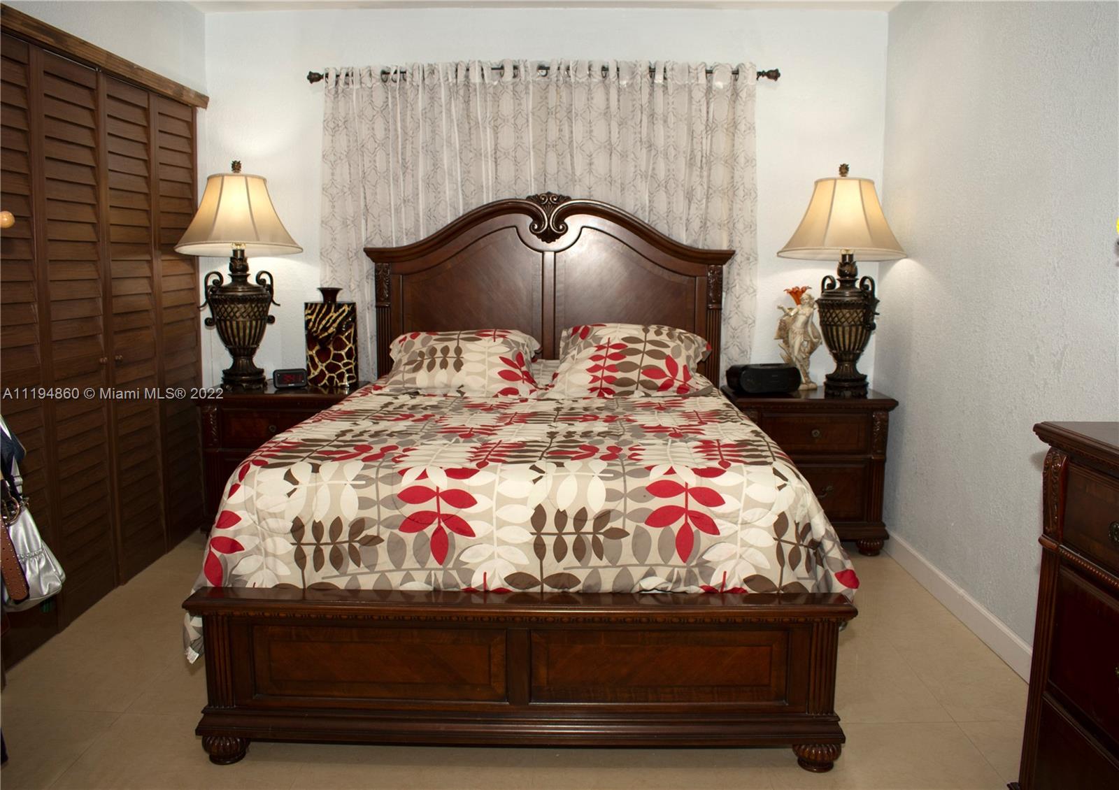 398 East 56th Street Hialeah, FL 33013 - Photo 19 of 30 a bedroom with bed and window