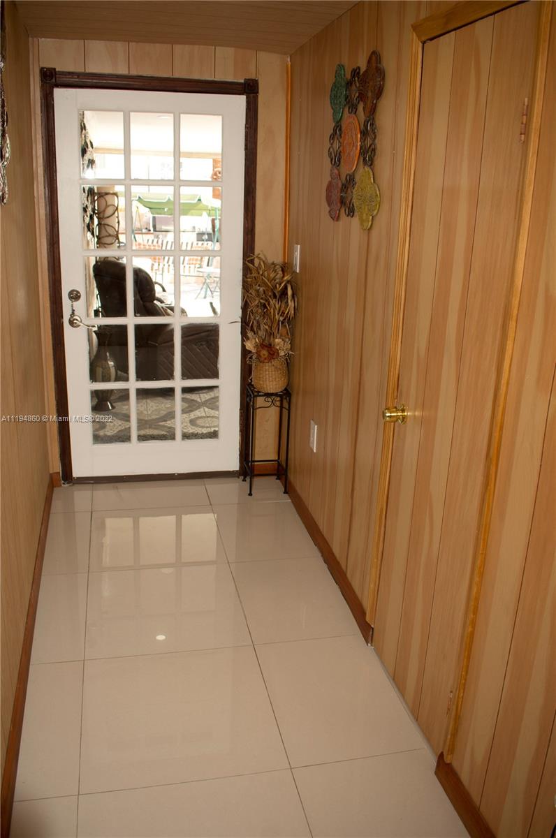 398 East 56th Street Hialeah, FL 33013 - Photo 26 of 30 a view of a door and wooden floor