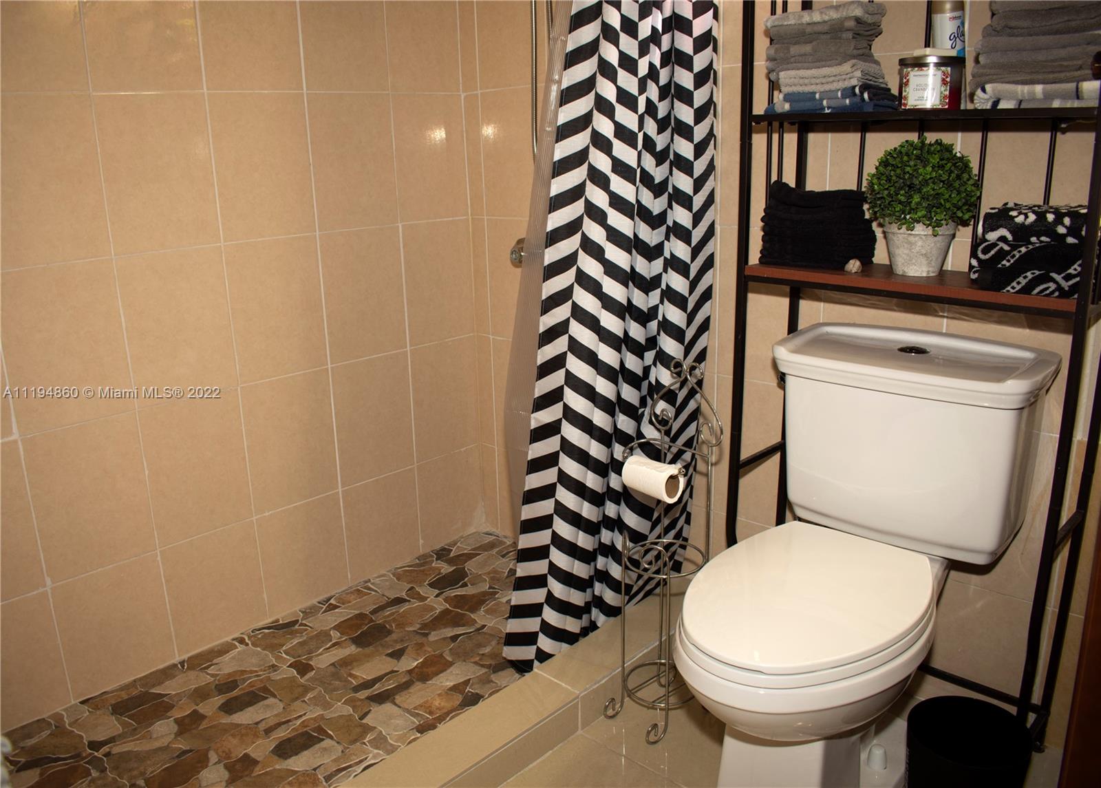 398 East 56th Street Hialeah, FL 33013 - Photo 28 of 30 a bathroom with a sink and a toilet