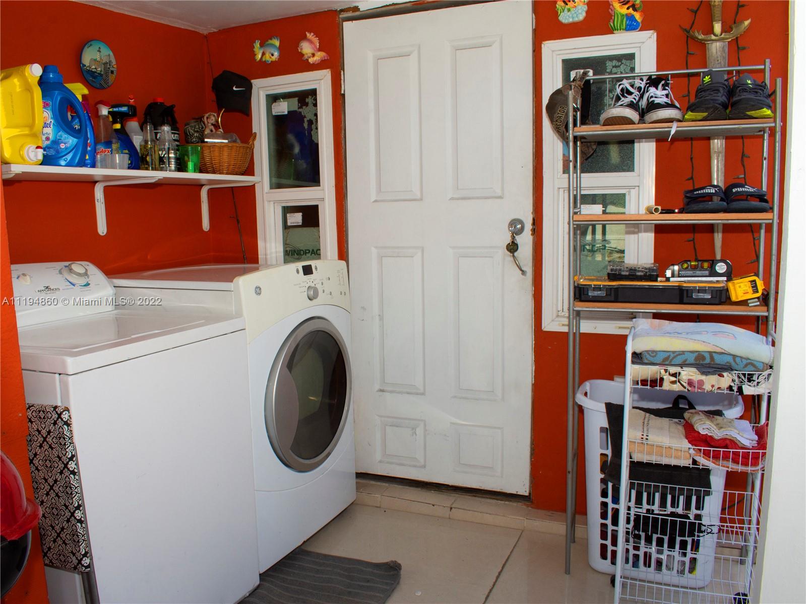 398 East 56th Street Hialeah, FL 33013 - Photo 5 of 30 a utility room with multiple dryer and washer
