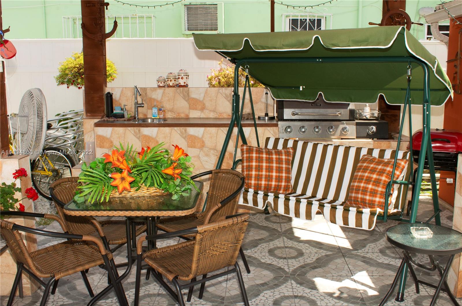 398 East 56th Street Hialeah, FL 33013 - Photo 10 of 30 a view of a chairs and table in the patio