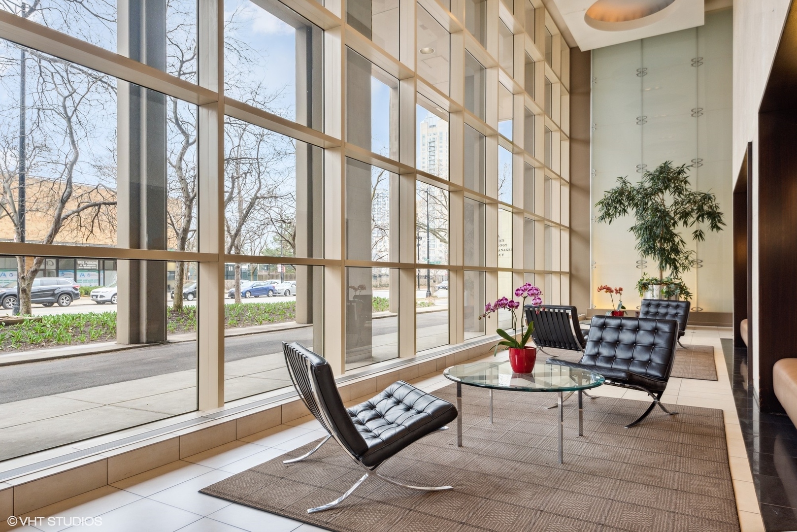 5320 North Sheridan Road, Unit 2403 Chicago, IL 60640 - Photo 2 of 18 a living room with furniture and floor to ceiling windows