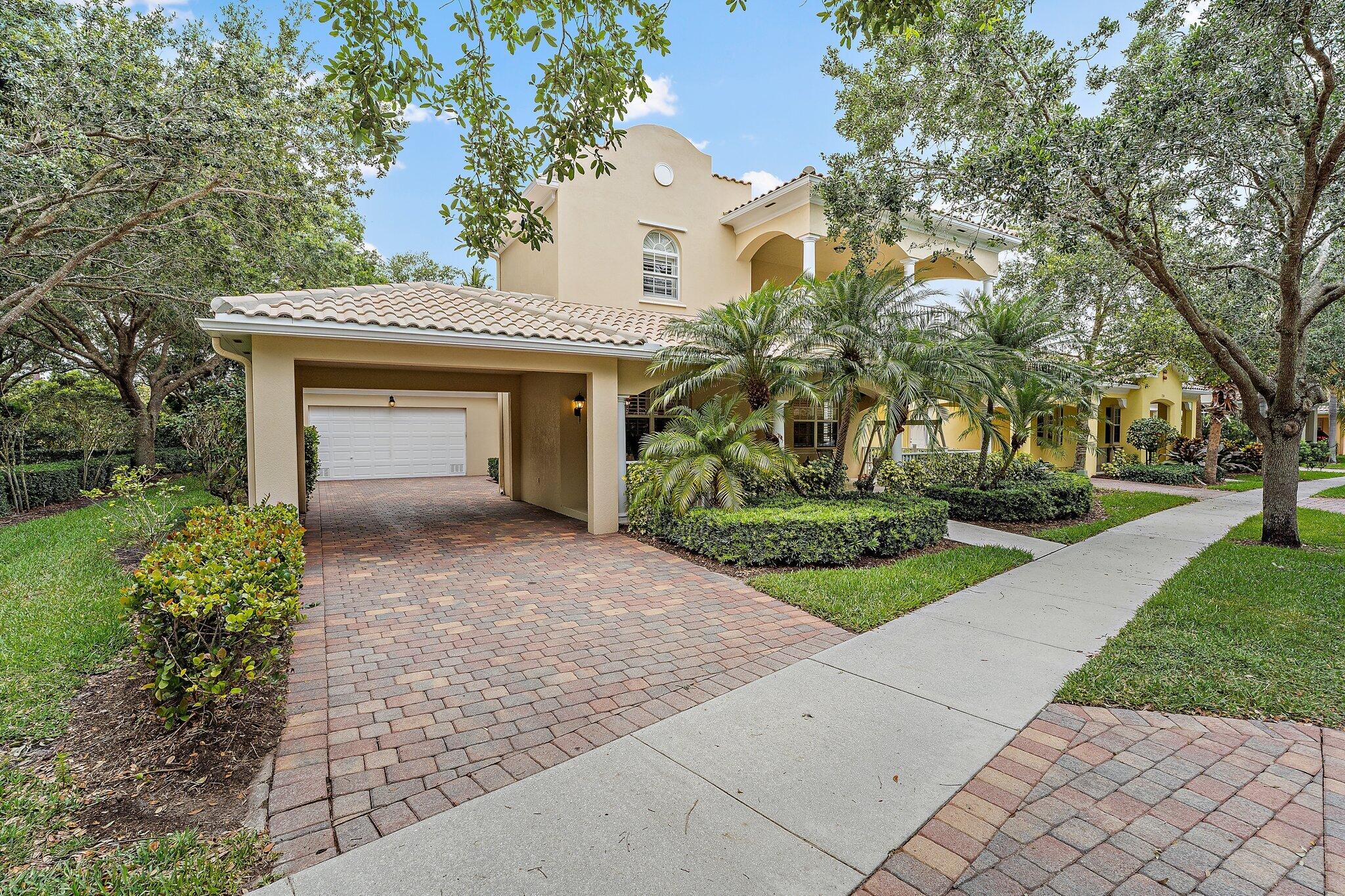 242 San Remo Drive Jupiter, FL 33458 - Photo 4 of 54 Front Exterior/Extended Driveway