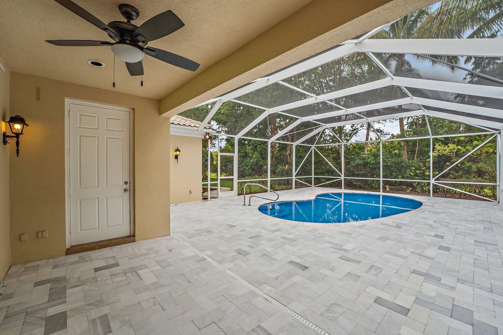 242 San Remo Drive Jupiter, FL 33458 - Photo 47 of 54 Newly Screened Outdoor Entertaining Area