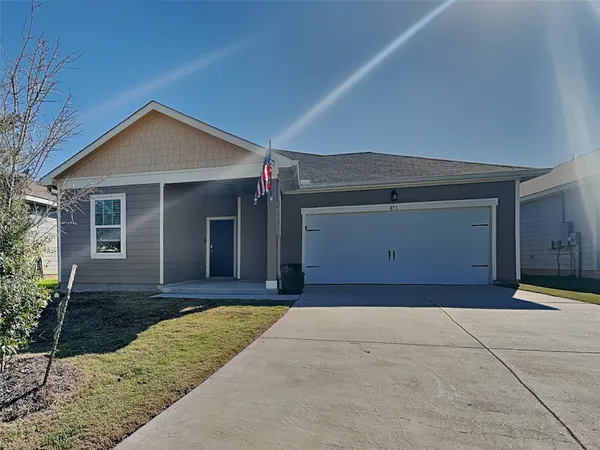 a front view of a house with yard