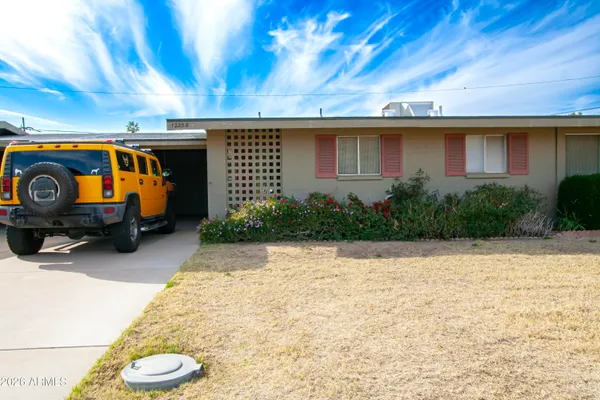 a view of garage with cars