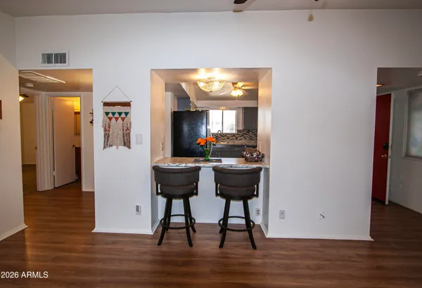 a dining room with furniture and window