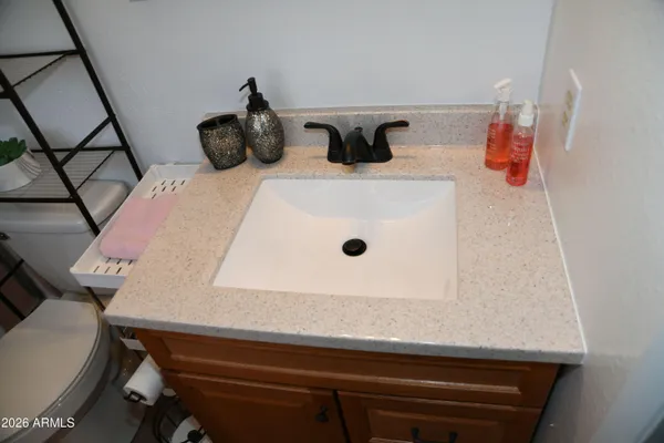 a bathroom with a sink and mirror