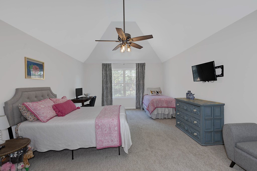 6712 Bridge Way Columbus, GA 31904 - Photo 27 of 36 a bedroom with a bed and flat screen tv