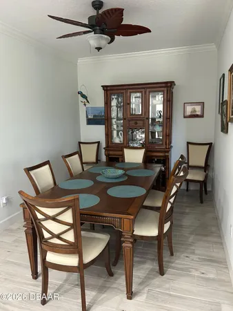 a dining room with furniture and window