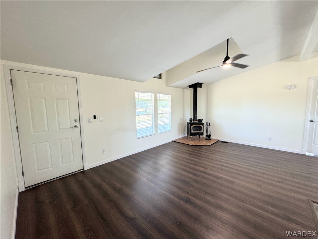 1575 South Roy Road Kingman, AZ 86401 - Photo 36 of 56 Living area featuring dark wood flooring, white walls, and a modern ceiling fan