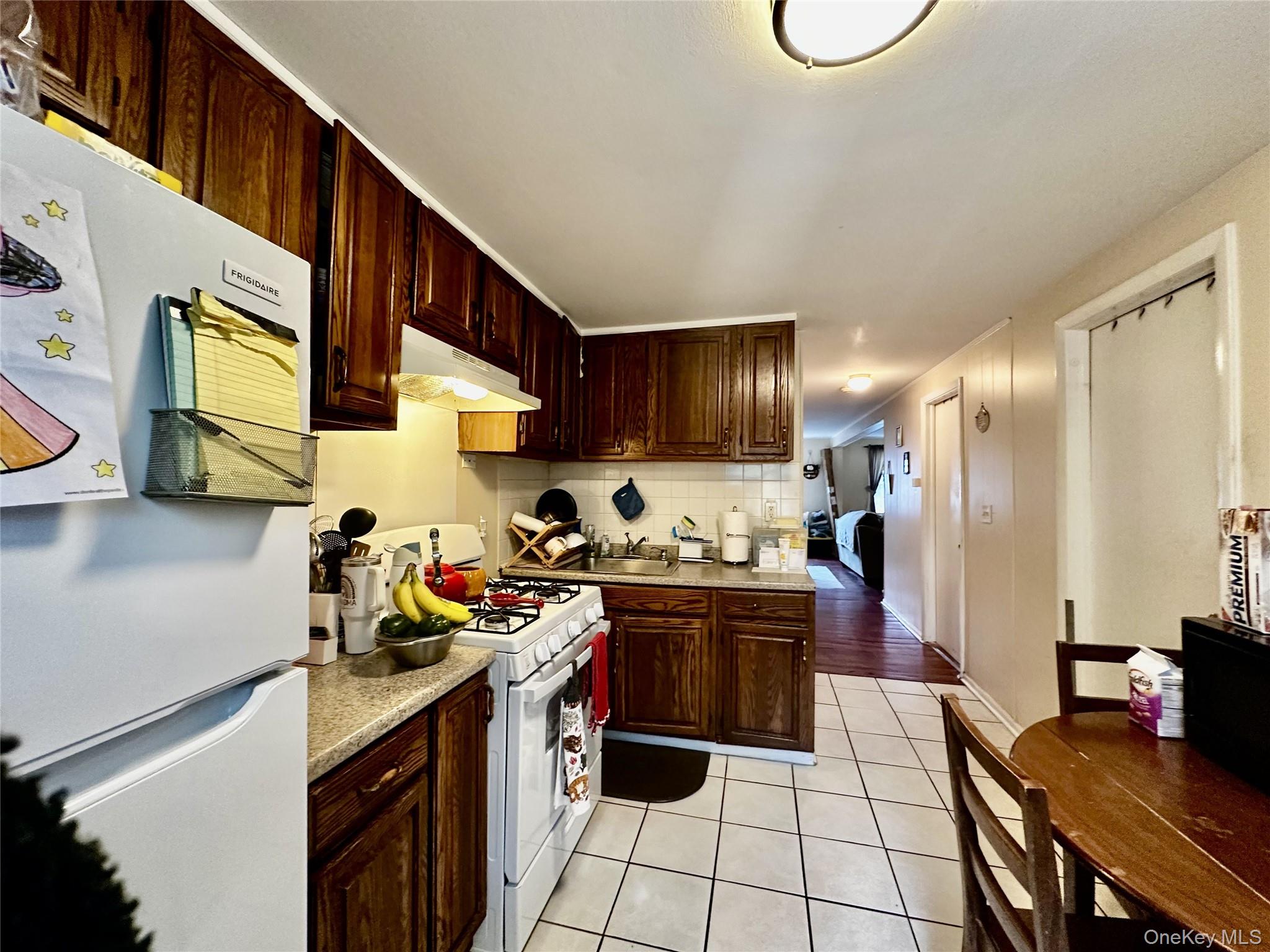 4 Jay Street Stony Point, NY 10980 - Photo 18 of 21 a kitchen with stainless steel appliances granite countertop a stove refrigerator sink and cabinets