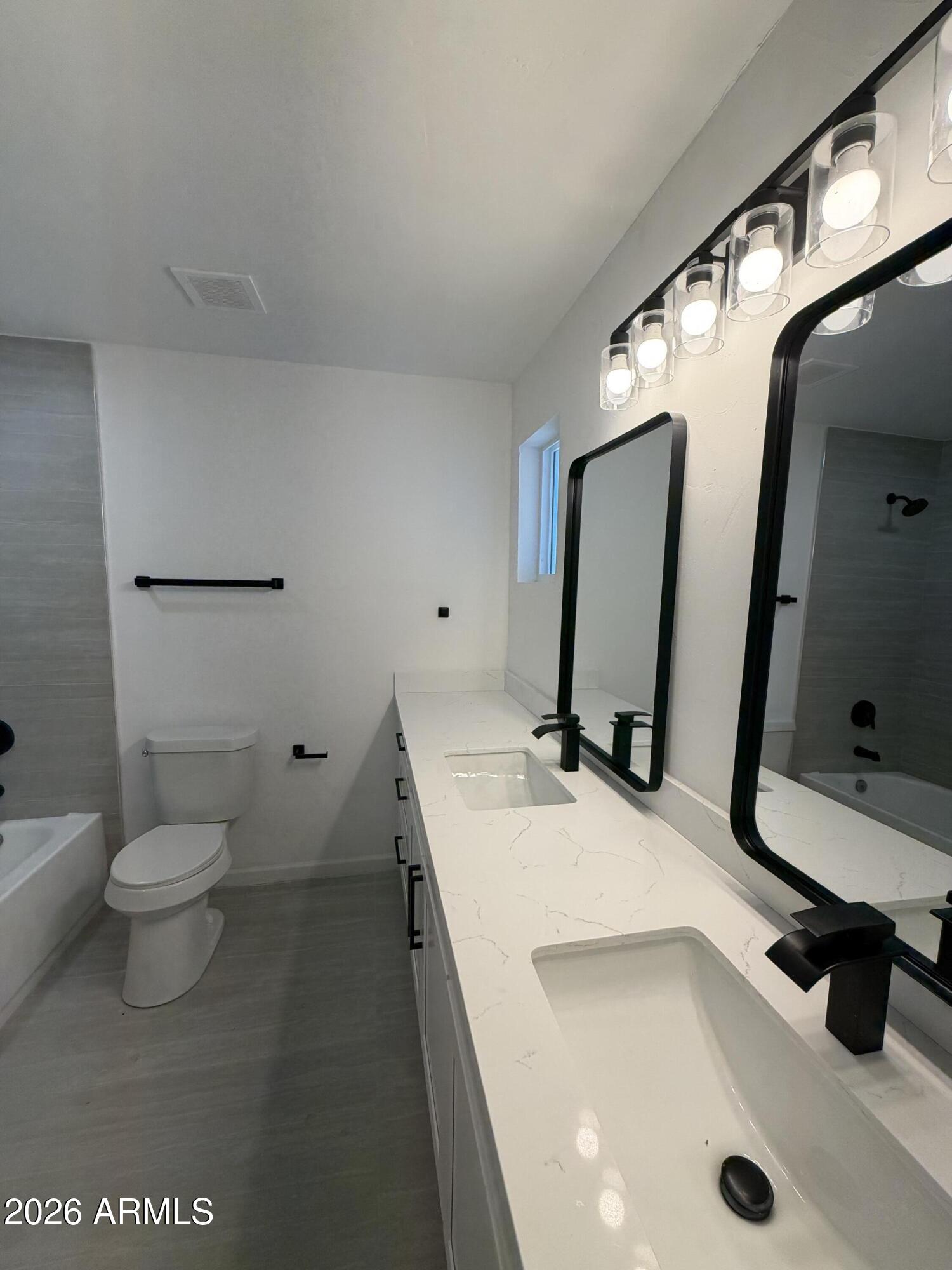1819 West Morten Avenue Phoenix, AZ 85021 - Photo 14 of 15 a bathroom with a sink and a mirror