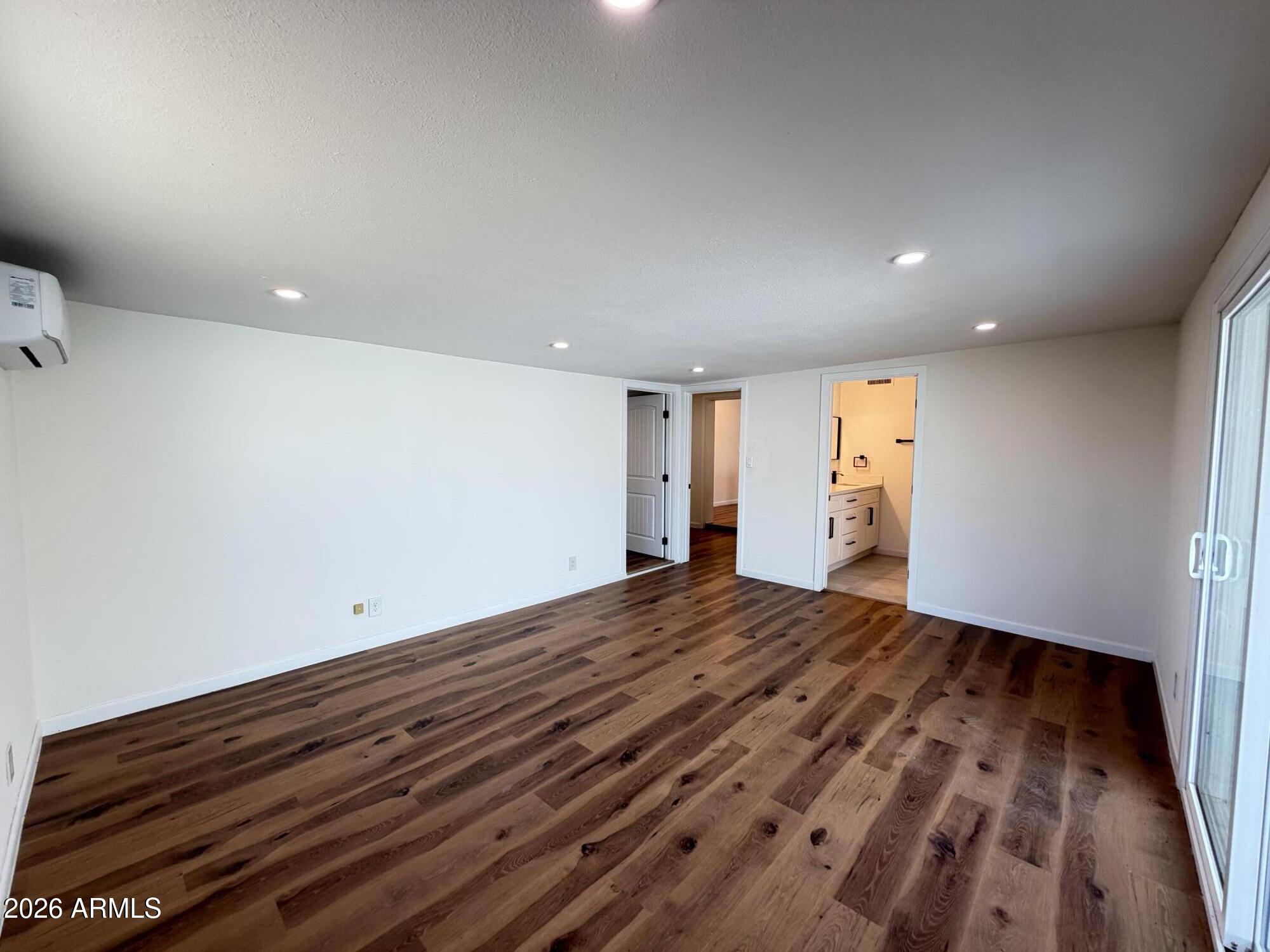 1819 West Morten Avenue Phoenix, AZ 85021 - Photo 4 of 15 a view of room with wooden floor and window