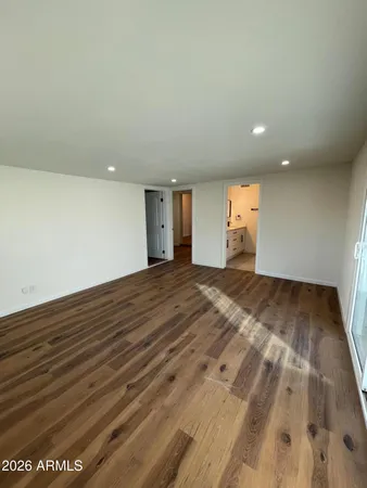 an empty room with wooden floor