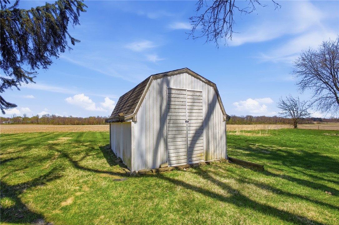 6718 Old Columbus Road South Vienna, OH 45369 - Photo 32 of 33 This shed sits amidst a spacious yard with ample outdoor possibilities.