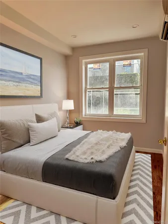 a bedroom with bed and window