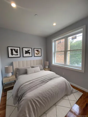 a bedroom with a large bed and a window