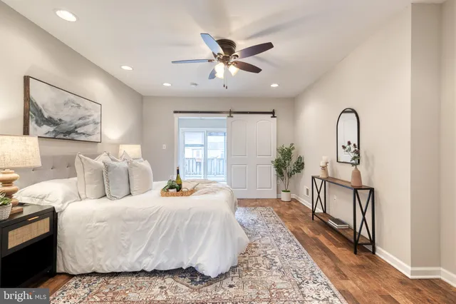 a bed room with bed and window