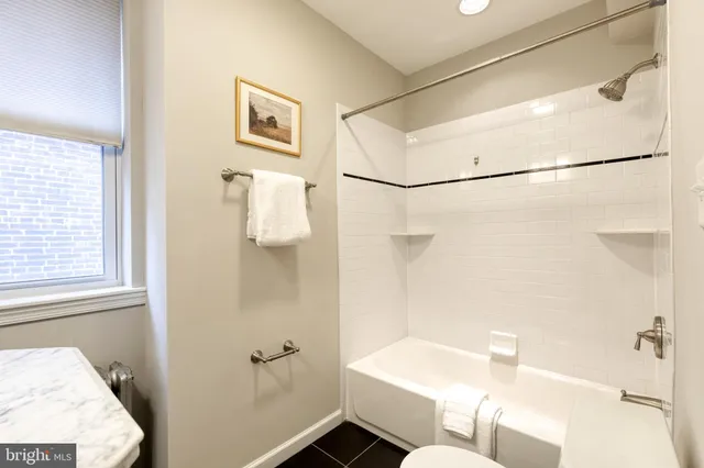 a bathroom with a sink and shower