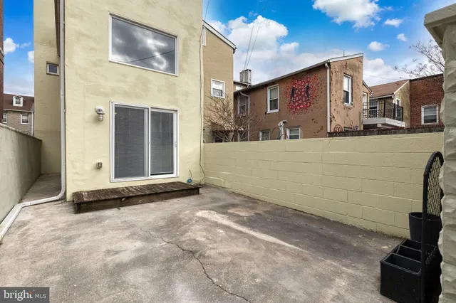 a front view of a house with car parked