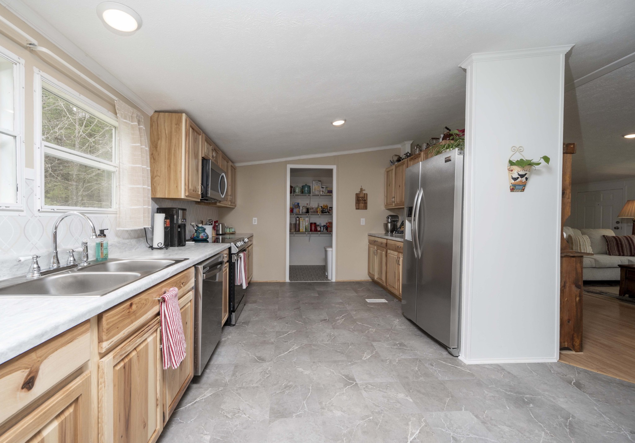 1822 Groveland Ridge Road Columbia, TN 38401 - Photo 11 of 48 a large kitchen with stainless steel appliances granite countertop a refrigerator and a sink